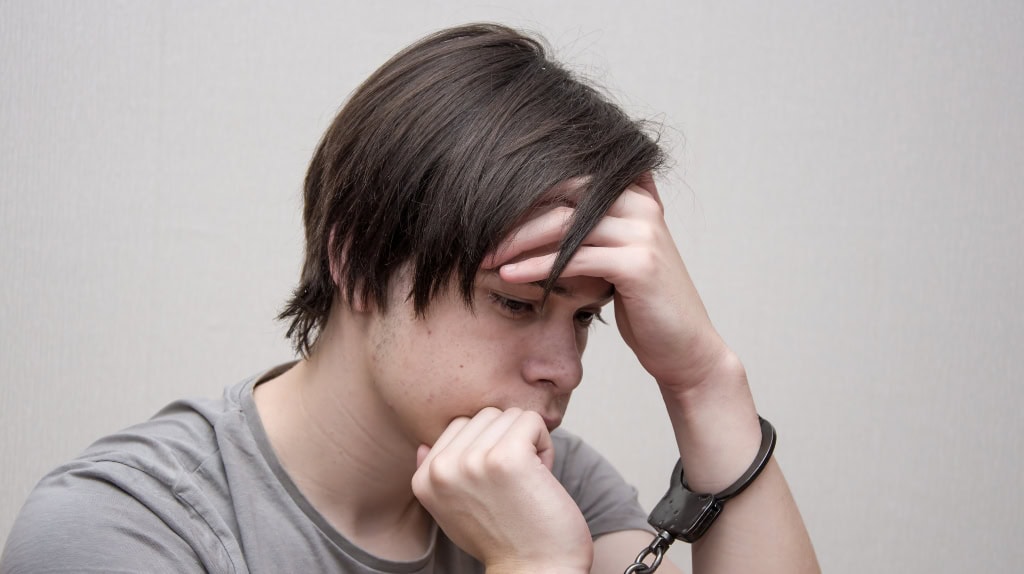 Indiana Criminal Defense: Frequently Asked Questions Kid with handcuffs