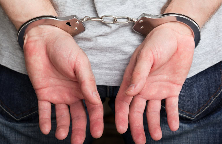 Which Criminal Offenses Are Eligible for Expungement in Indiana? man's hands in handcuffs